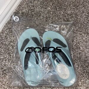 OOFOS Sky Blue Sandals with Black Straps